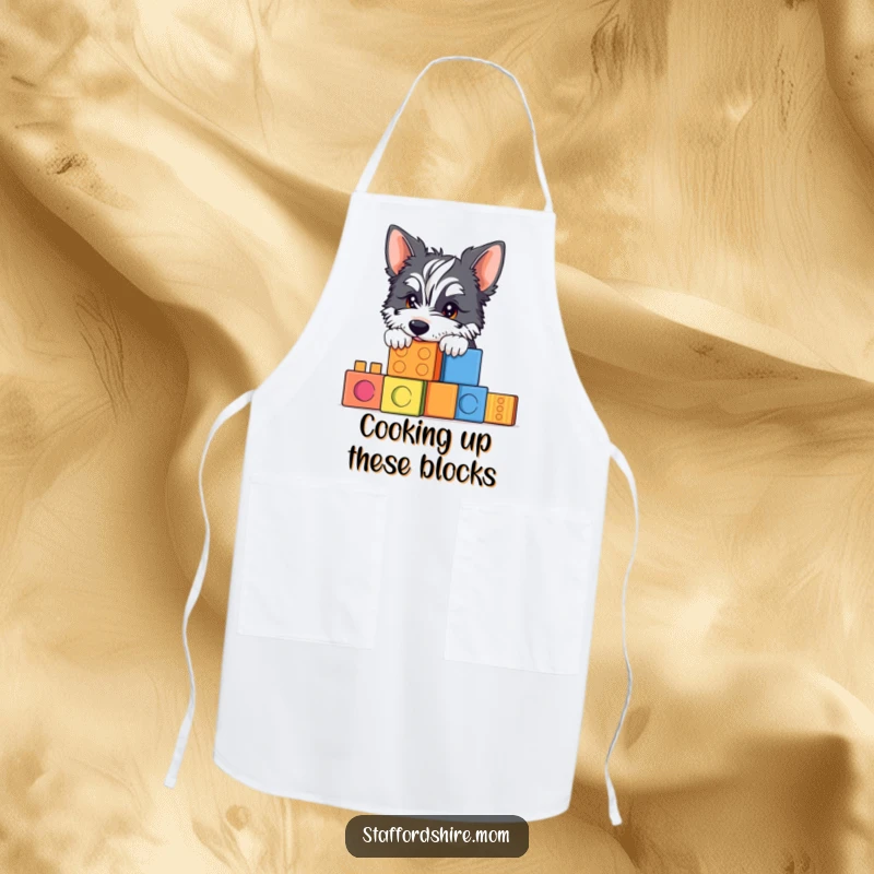 Funny Staffy apron showing a dog peeking over building blocks, perfect for chefs who love playful humor.