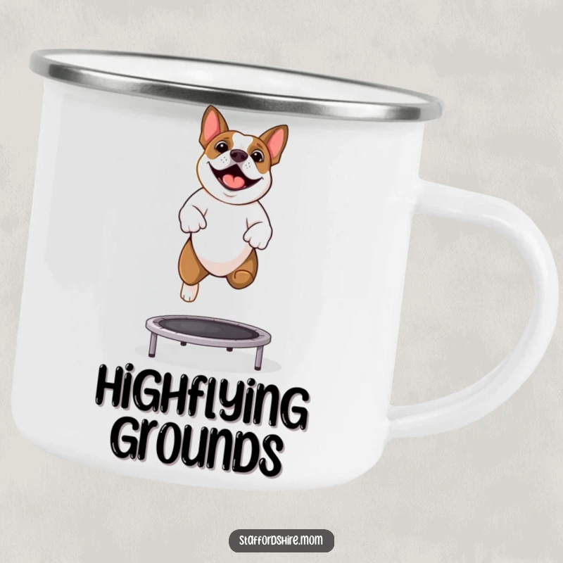 Funny Staffy camping mug showing a happy Staffordshire Bull Terrier bouncing on a trampoline outdoors.