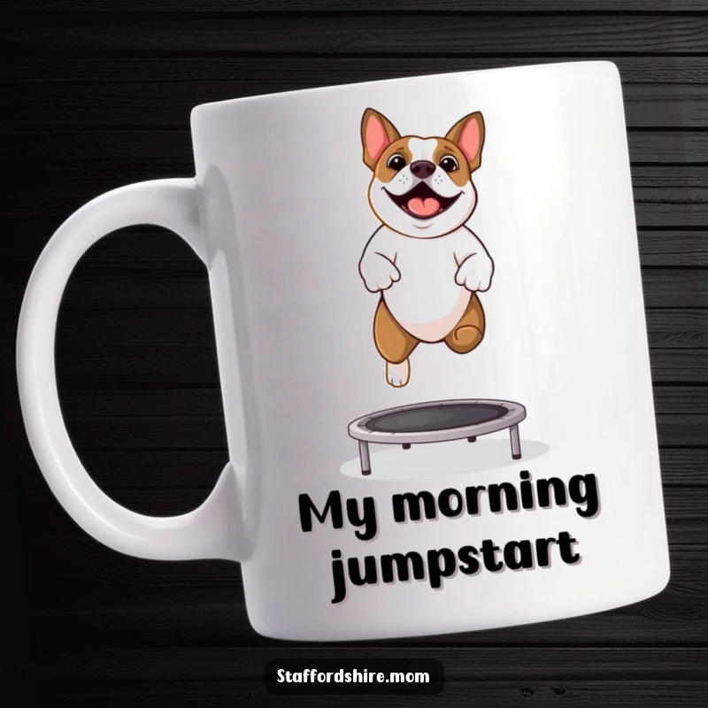 Funny Staffordshire Bull Terrier mug showing a happy dog bouncing with pure joy on a tiny trampoline.