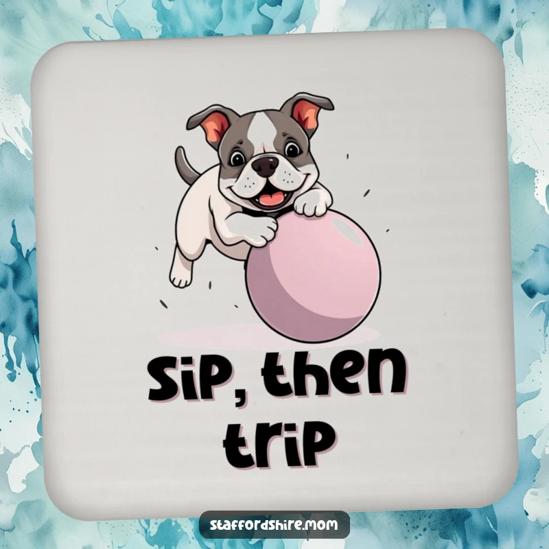 Funny Staffordshire Bull Terrier coaster showing a dog hilariously tripping over a large ball, protecting surfaces with canine comedy.