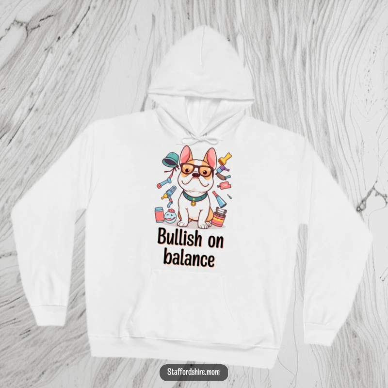 Funny Staffy hoodie showing a Staffordshire Bull Terrier concentrating on balancing multiple items, cozy and cute.