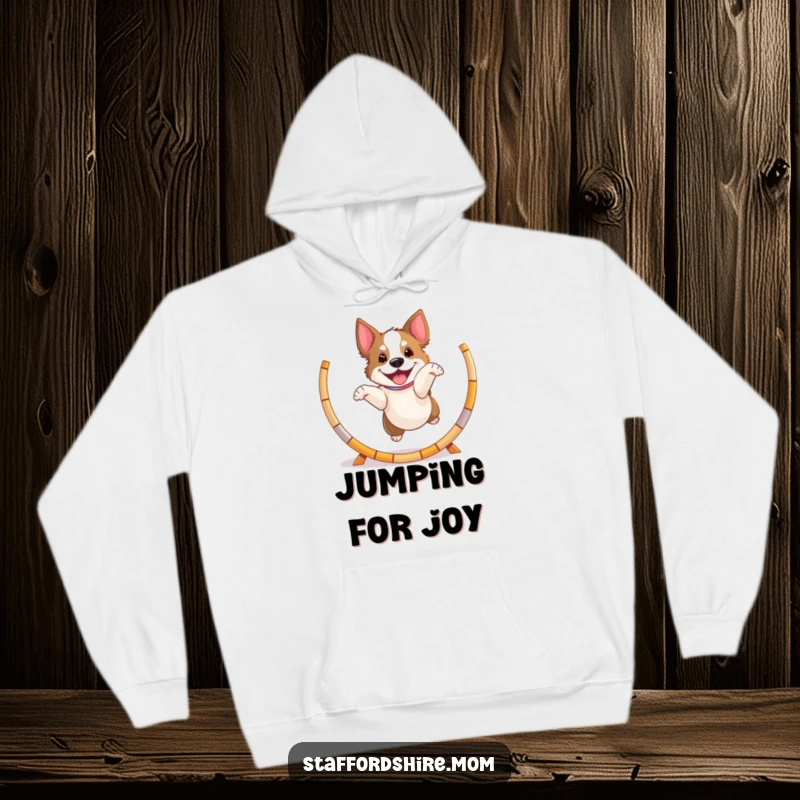 Funny playful Staffordshire dog hoodie, jumping through a hoop with excitement, cozy and energetic pet wear.