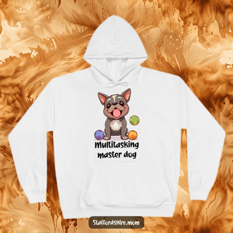 Funny Staffordshire terrier hoodie, a dog impressively juggling balls with amused focus, perfect cozy funny gift.