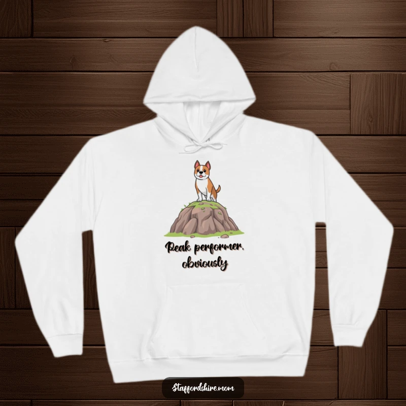 Funny Hoodie depicting a brave Staffordshire dog standing resolutely on a miniature hill, radiating warmth and a funny sense of accomplishment.