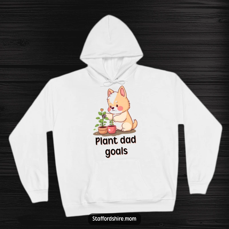 Funny hooded sweatshirt showing a cute Staffordshire with rosy cheeks happily watering a little plant, ideal for plant lovers and dog owners.