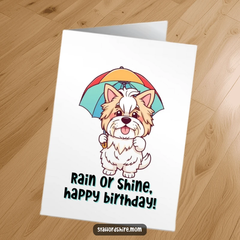 Funny Free Printable Birthday Card: A friendly Staffordshire waves hello, holding a vibrant rainbow umbrella, ready for fun.