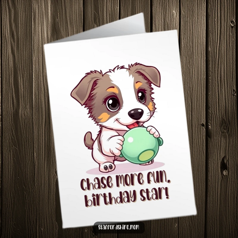 Funny Free Printable Birthday Card: A Staffordshire dog with bright, eager eyes focused intently on chasing a squeaky toy.