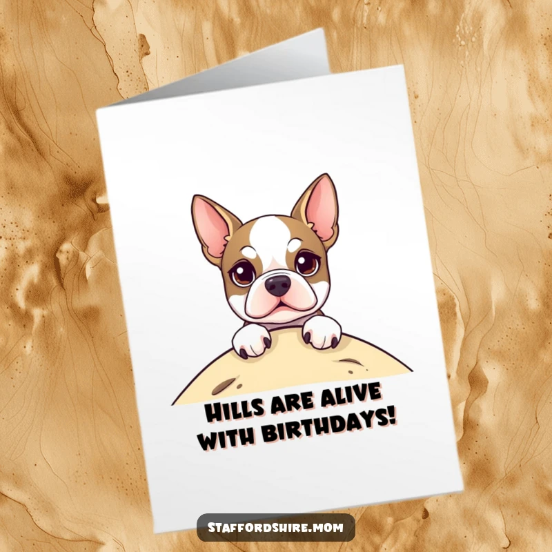 Funny Free Printable Birthday Card featuring a Staffordshire Terrier with bright eyes peeking curiously over a grassy hill.