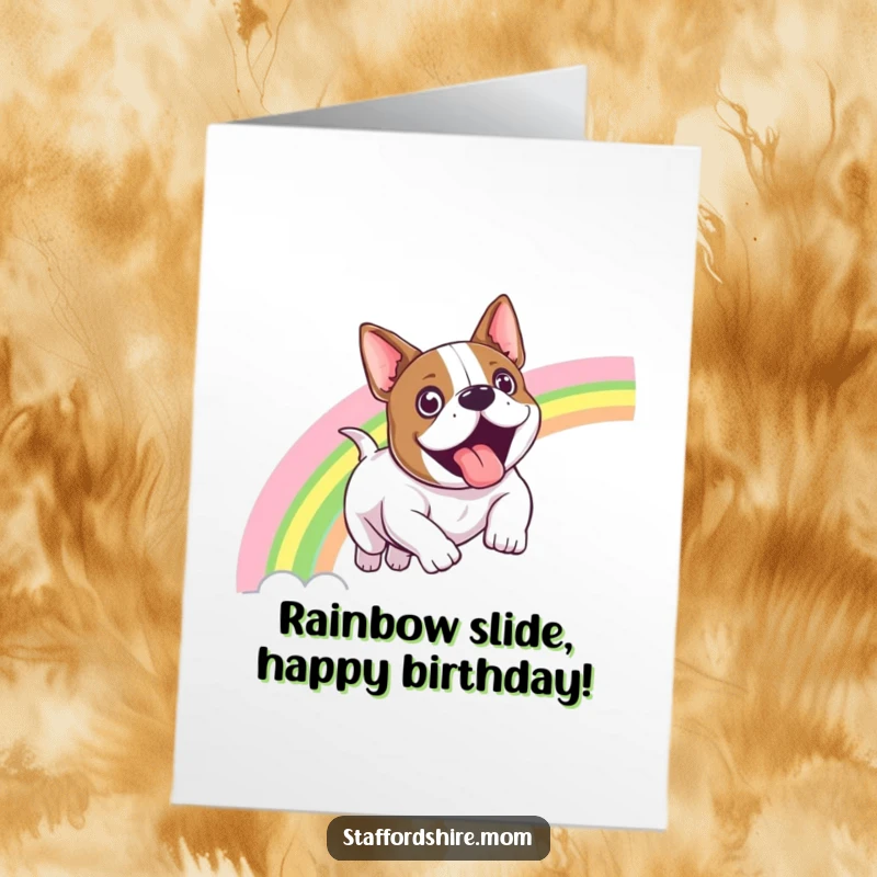 Funny Free Printable Birthday Card: Exhilarated Staffordshire bull terrier sliding down a vibrant rainbow.