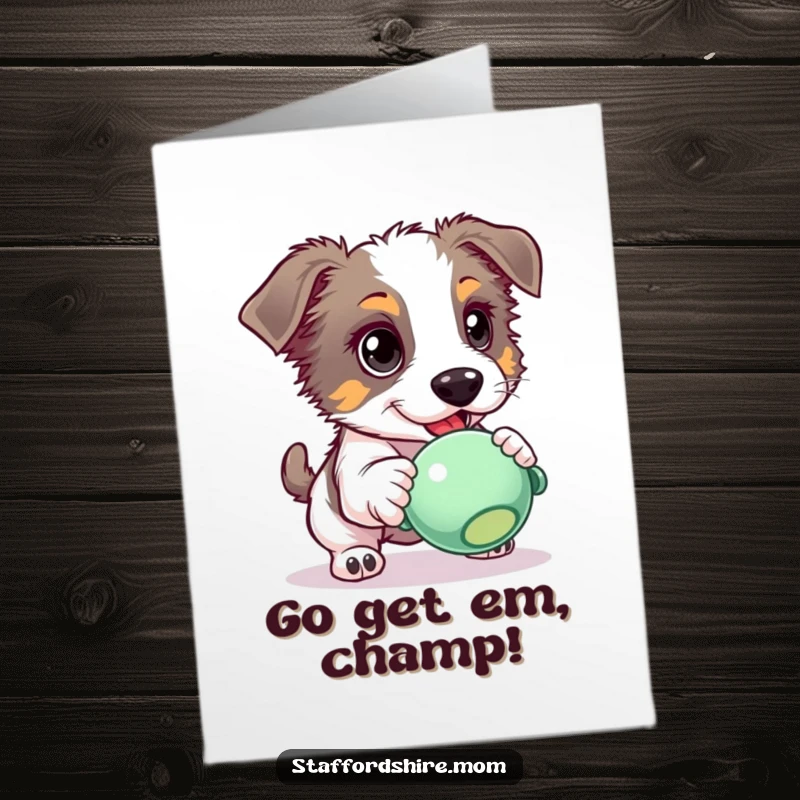 Funny Free Printable Congratulations Card: A Staffordshire dog with eager eyes intensely chasing after a squeaky toy, full of drive.