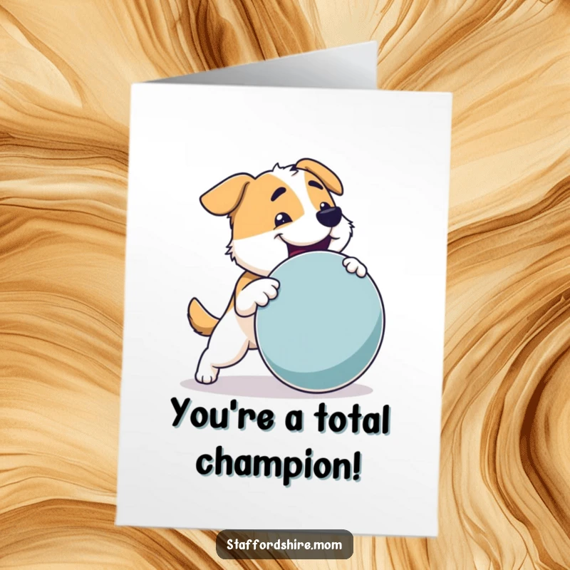 Funny Free Printable Congrats Card: Sturdy dog joyfully fetches a large round toy, celebrating success with powerful enthusiasm.