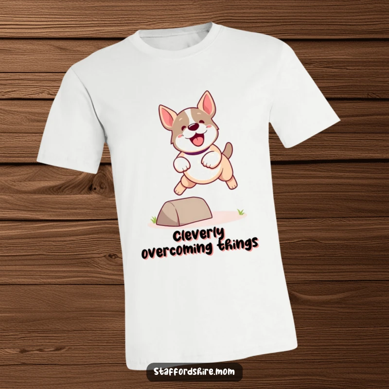 Funny Kawaii Staffordshire Dog T-Shirt depicting a cute, energetic dog leaping dynamically over a small obstacle, active apparel.