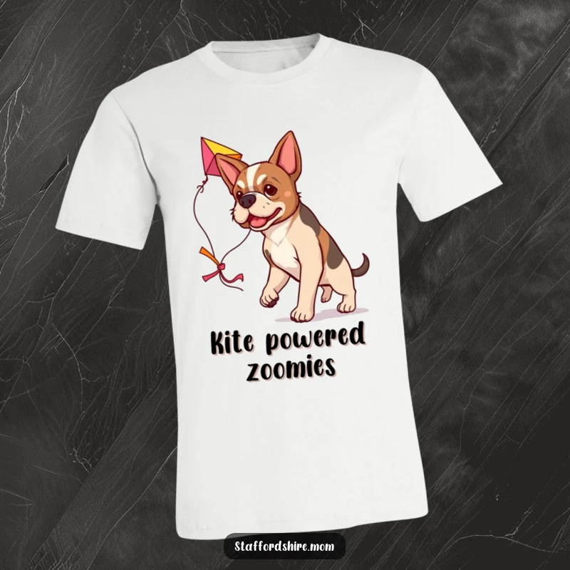 Funny determined Staffordshire dog t-shirt, carrying a large kite, motivational and humorous pet graphic.