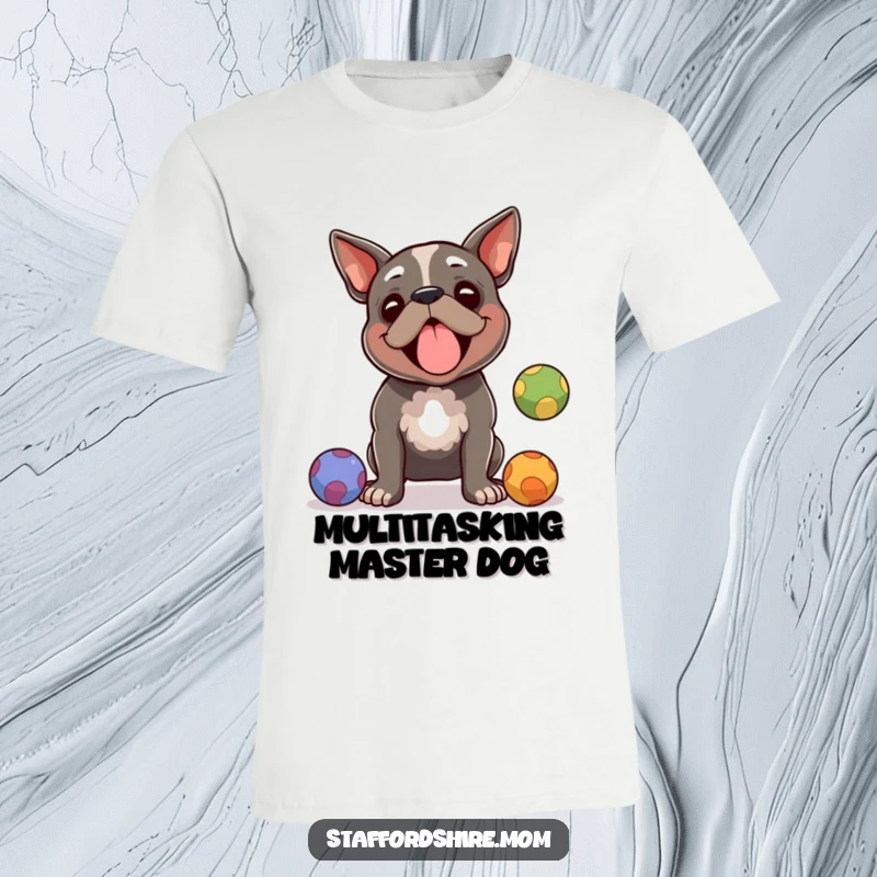 Funny Staffordshire terrier t-shirt, a focused dog juggling colorful balls with amused expression, great funny gift.