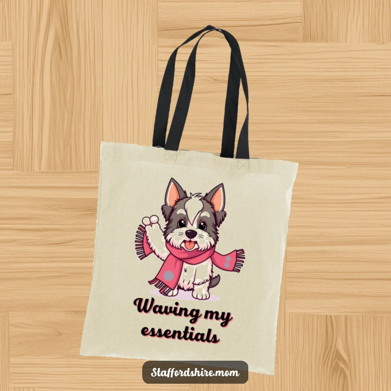 Funny Staffordshire tote bag showing a dog energetically waving a patterned scarf, perfect for carrying essentials with zest.